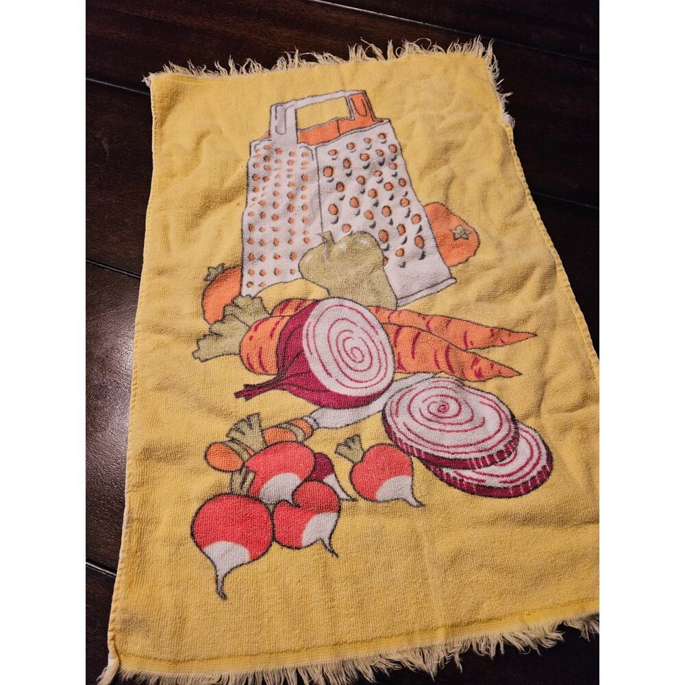 Vintage 1970s yellow kitchen towel with cheese grater, produce, and a knife
